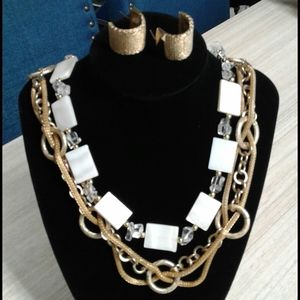 2 necklaces and a pair of earrings